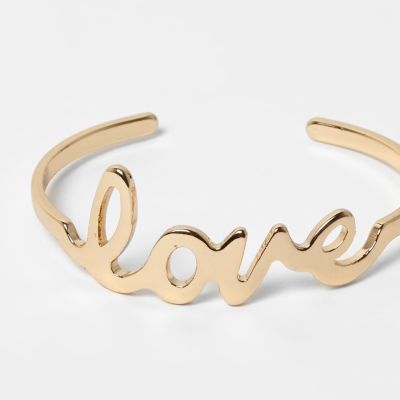 Gold tone &#39;Love&#39; cuff bracelet